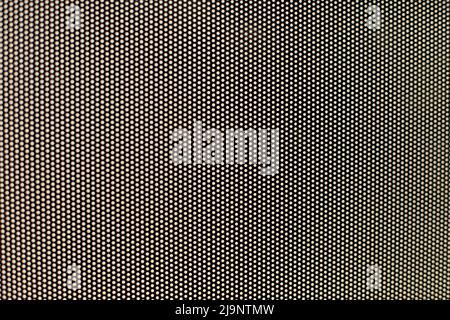 Film on glass of mesh texture. Advertising film from inside interior of bus. Fine grid and blurry background. Stock Photo
