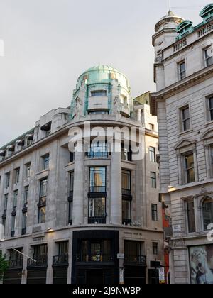 London, Greater London, England, May 11 2022: Multi storey green topped building on the corner of Regent Street and Heddon Street Stock Photo