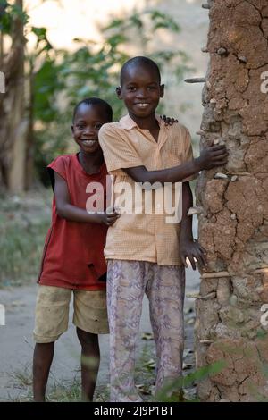 Mali,Kenya - Agust 12 2021:A poor village in Africa, happy children playing games with their friends. Stock Photo