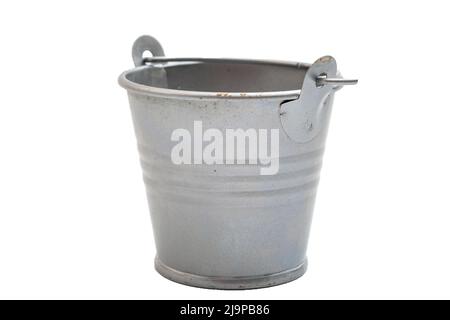 Cleaning and washing, rural tools and household carrying container concept with old fashioned metallic silver bucket and no people isolated on white b Stock Photo