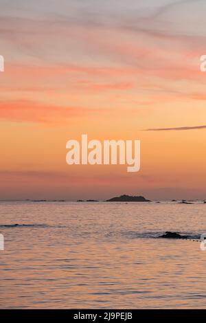 sunset over the sea in Spain in summer vertical view Stock Photo
