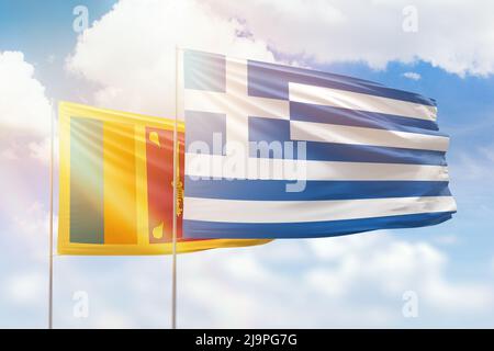 Sunny blue sky and flags of greece and sri lanka Stock Photo