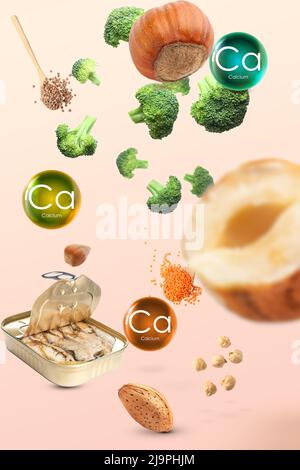 Flying healthy products rich in calcium on light background Stock Photo