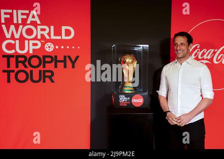 Addis Ababa, Ethiopia. 24th May, 2022. Former Brazilian football player Juliano Belletti poses with the trophy during the FIFA World Cup Trophy Tour event in Addis Ababa, Ethiopia, on May 24, 2022. Credit: Michael Tewelde/Xinhua/Alamy Live News Stock Photo