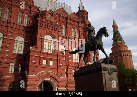 Moscow, Russia. 20th May, 2022. The Marshal Zhukov monument is seen on the backdrop of the the State Historical Museum of Russia. The statue depicts the Soviet military leader crucial to WWII victory riding a horse that tramples with its hooves the Nazi banners and the Nazi coat of arms. Russian authorities claim that one of the goals of the Russian military operation in Ukraine is to clear Ukraine from the Nazis. (Credit Image: © Vlad Karkov/SOPA Images via ZUMA Press Wire) Stock Photo
