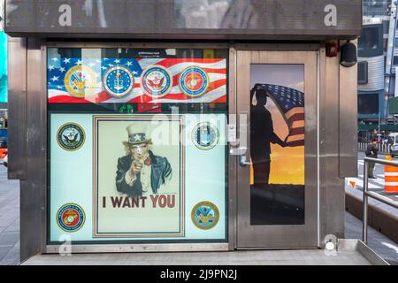 New York, NY - USA - May 10, 2022 Horizontal view of the iconic US Armed Forces Times Square Recruiting Station. A glass and stainless steel box on Br Stock Photo