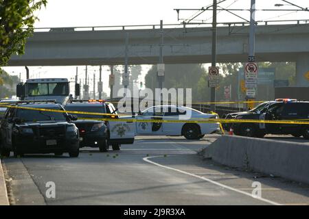 Crime scene tape surrounds the site of shooting involving a California Highway Patrol officer at Ford Blvd. and Third St., Tuesday, May 24, 2022, in Los Angeles. Stock Photo