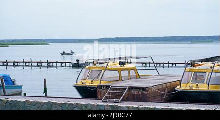 Motor boats moored at the pier Stock Photo