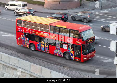 Moscow, Russia - December 11, 2015:  Red tour bus near the Moscow Kremlin Stock Photo