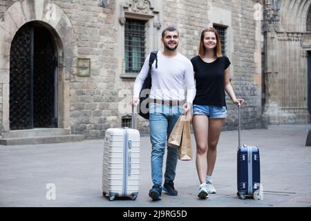 Couple going the historic city center Stock Photo