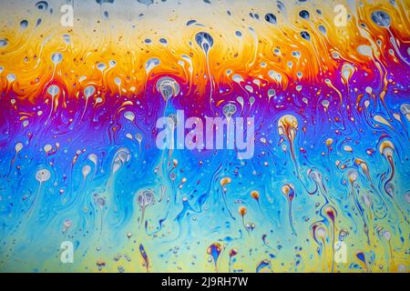Abstract pattern of refracted light in soap bubble. Stock Photo