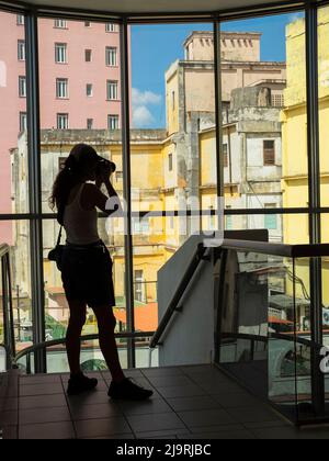 Cuba, Havana, Havana Vieja, UNESCO World Heritage Site, woman taking a photo from inside Museu Nacional de Belas Artes de Cuba (art museum) Stock Photo