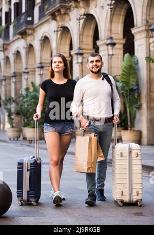 Young couple man and woman going the historic city center Stock Photo