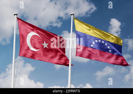 Turkey and Venezuela two flags on flagpoles and blue cloudy sky background Stock Photo