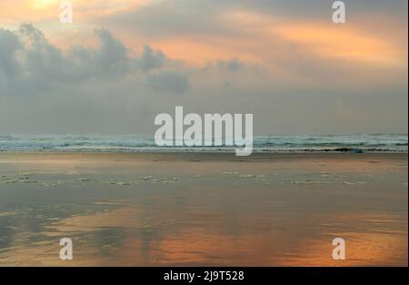 Sunset over the Pacific Ocean at Cannon Beach, Oregon, USA Stock Photo