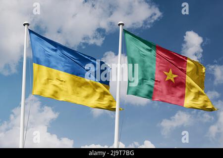 Ukraine and Cameroon two flags on flagpoles and blue cloudy sky background Stock Photo