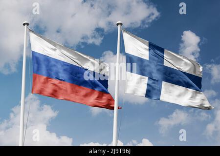 Russia and Finland two flags on flagpoles and blue cloudy sky background Stock Photo