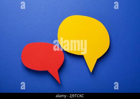 Speech bubbles on blue background, space for text Stock Photo