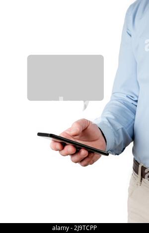 Mockup of a man using a cell phone on a white background to include messages, advertisements, announcements or greetings Stock Photo
