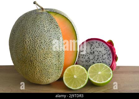 Vietnamese fruit on wooden table against white background Stock Photo