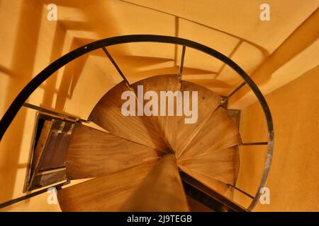 photograph of old wooden spiral staircase seen from above Stock Photo