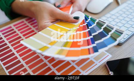 Graphic designer is working on choosing palette colors for creative business Stock Photo