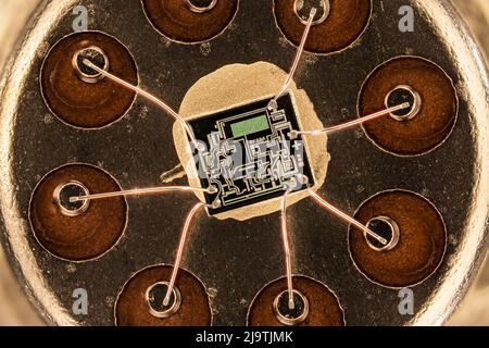 Housing with integrated circuit, light micrograph Stock Photo