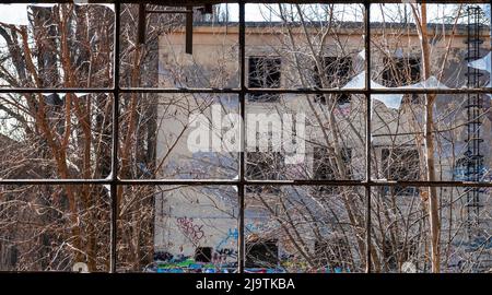 Broken window in abandoned place Stock Photo