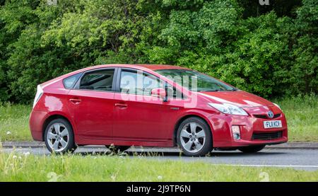 toyota prius hybrid car red Stock Photo - Alamy