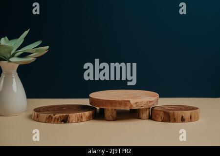 Wooden podium for a product packshot placement on dark background Stock Photo