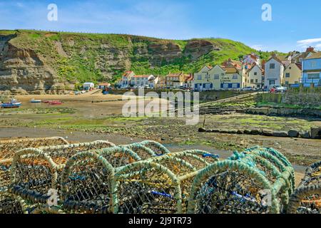 Harbour and village with the 'Cod & Lobster' Inn at Staithes, North Yorkshire, England. Stock Photo