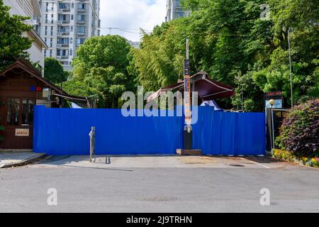 The entrance of a residential compound in Minghang District, Shanhai is barricaded during the COVID-19 lockdown. Stock Photo