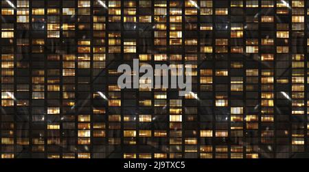 windows building front facade by night Stock Photo