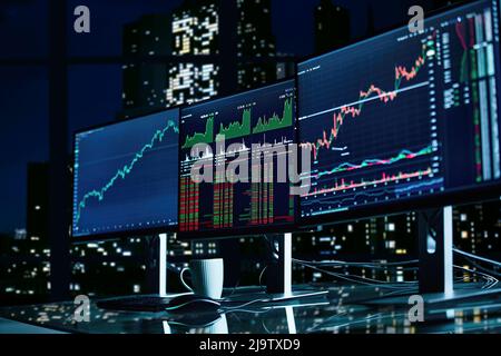 working computers on the trader-investor's desk. close-up. Stock Photo
