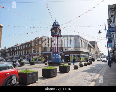 Sheerness, Kent, UK. 25th May, 2022. [FILE PHOTO from 2018] Jubilee bunting for Sheerness town centre/high street in Kent has been 'cancelled' following complaints the plastic bunting the town council had started to install a few weeks ago was too 'noisy'. The lack of 'fanfare' is all the more strange given the 120 year old town centre clock tower has only just been returned and restored in time especially for the Queen's Platinum Jubilee weekend. Most years bunting surrounds the town clock. [FILE PHOTO the town centre clock with bunting April 2018]. Credit: James Bell/Alamy Live News Stock Photo