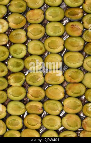 Sliced plums before home freezing. High resolution photo. Full depth of field. Stock Photo