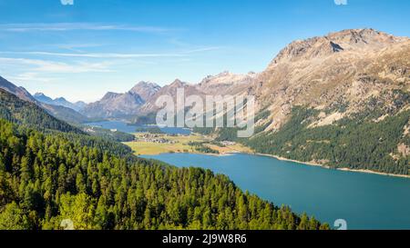 The Corvatsch cable car in Surlej (Switzerland) offers stunning views over the Engadin Valley towards Maloja, Lake Sils and Lake Silvaplana. Stock Photo