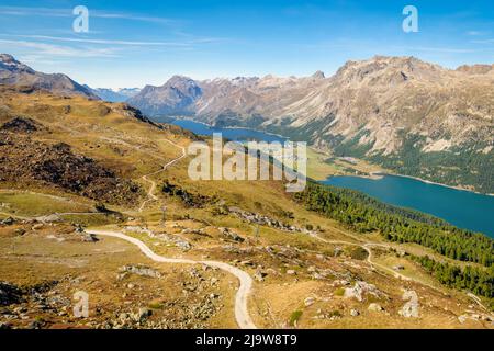 The Corvatsch cable car in Surlej (Switzerland) offers stunning views over the Engadin Valley towards Maloja, Lake Sils and Lake Silvaplana. Stock Photo