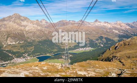 The Corvatsch cable car in Surlej (Switzerland) offers stunning views over the Engadin Valley towards Maloja, Lake Sils and Lake Silvaplana. Stock Photo