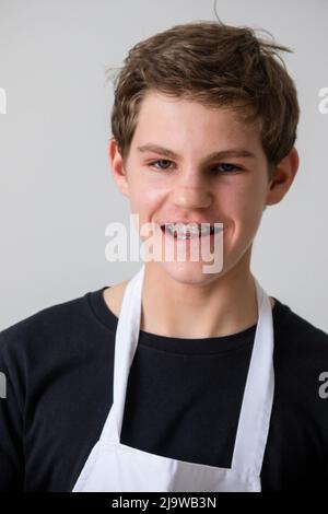 A teenage boy in a domestic kitchen Stock Photo