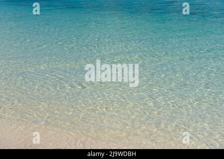 Turquoise colored ocean and sandy beach in Semporna, Sabah Borneo, Malaysia Stock Photo
