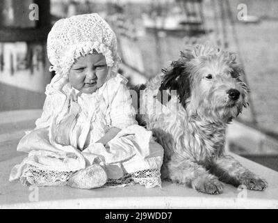 Sam Hood - Australian Baby and a Dog on a Sailing Ship - 1910 Stock Photo