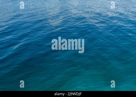 Azure colored water surface with texture natural background Stock Photo