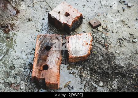 Old broken bricks at the construction site - top view. Industrial background Stock Photo