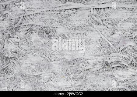 Close up of white and gray swirls of paint and string wall texture in Bali, Indonesia Stock Photo