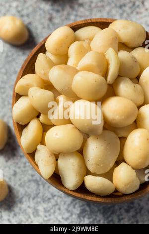 Raw Shelled Organic Macadamia Nuts in a Bowl Stock Photo