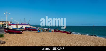 Inshore fishing boats drawn up on the shingle beach at Bognor Regis, West Sussex, UK Stock Photo