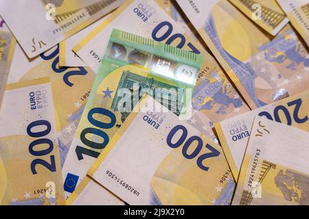 100 and 200 euro bills on the table . background of paper money Stock Photo