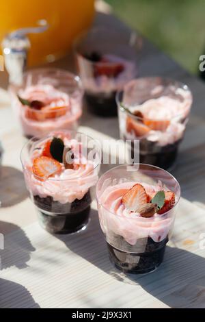 Pink Frosted Cupcakes with a Strawberry on Top. High quality photo Stock Photo