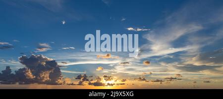 Evening sky with dramatic clouds over the sea. Dramatic sunset over the sea Stock Photo